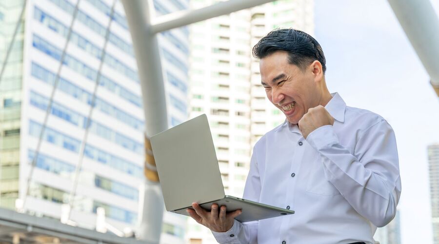 Manpower older worker looking at laptop
