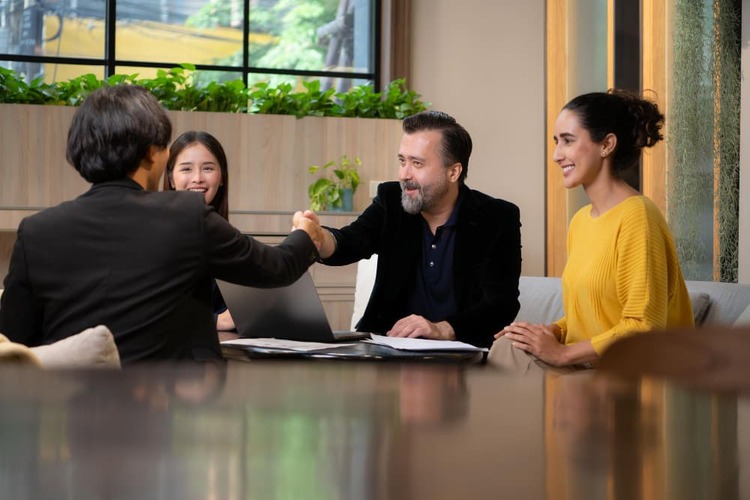 An EOR service consultant from Manpower Vietnam is shaking hand with a client