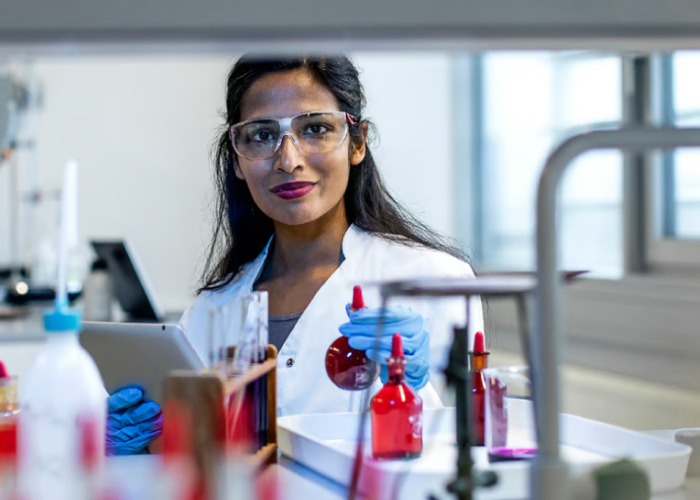 Female workers working in a laboratory is happy and confident