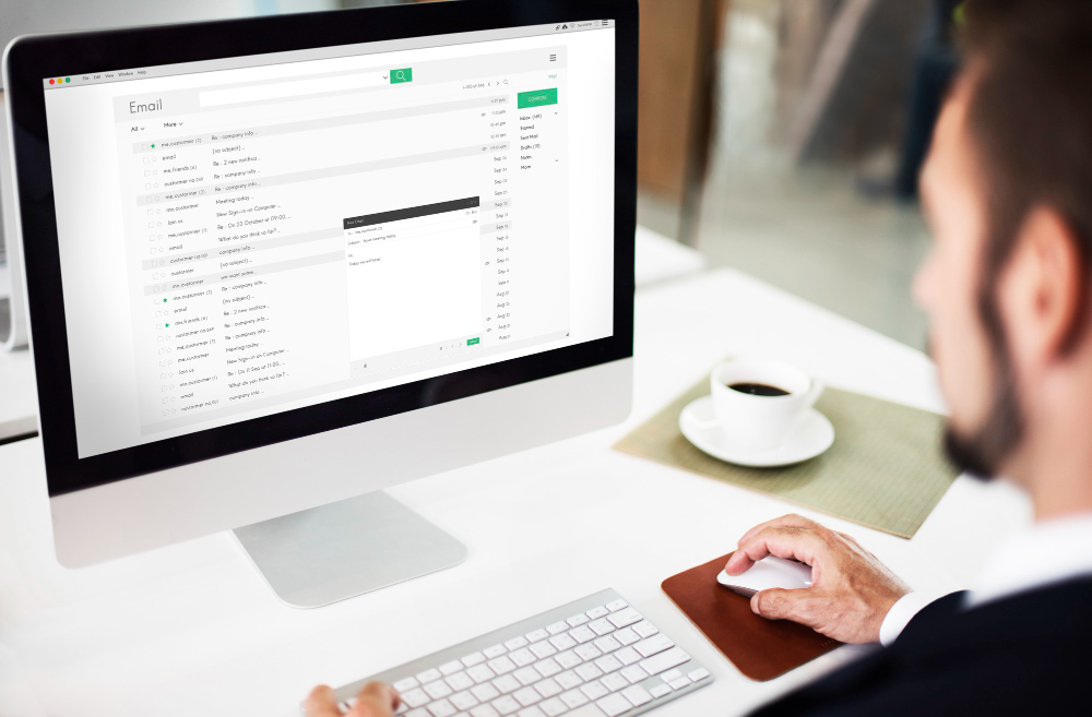An applicant is preparing to reply to an interview invitation on a computer.