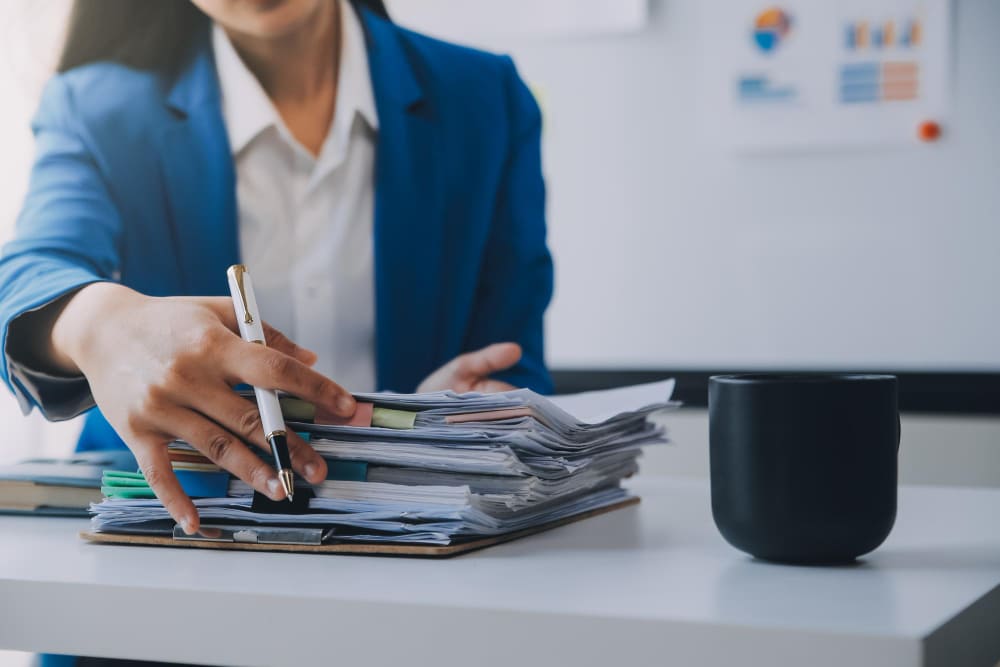 Employees managing the needed documents for HR compliance 