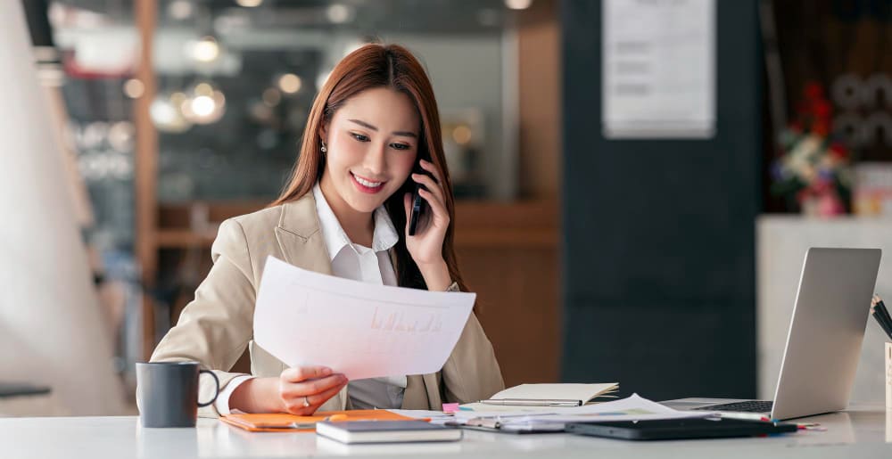 Businesswoman on the phone talking recruitment process outsourcing service