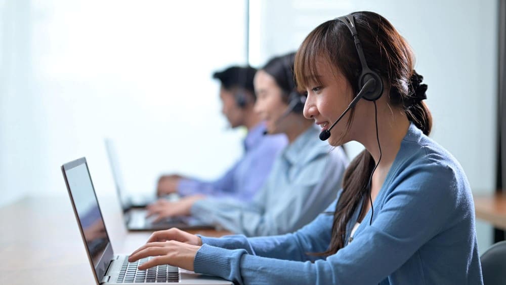 Recruiters coordinating candidate sourcing and screening for a mass recruitment service