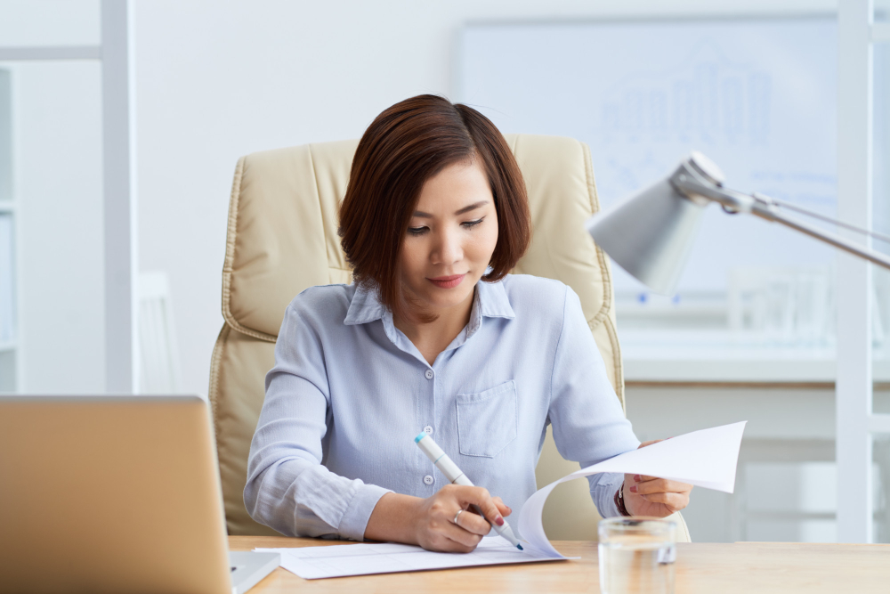 Manpower's accountant calculating salary and tax for their clients who use the staffing service.