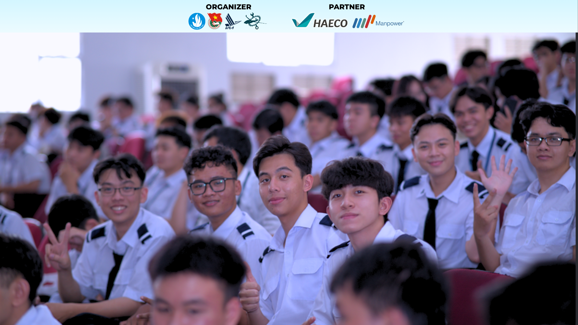 Students engaging with Manpower Vietnam advisors about aviation career pathways.