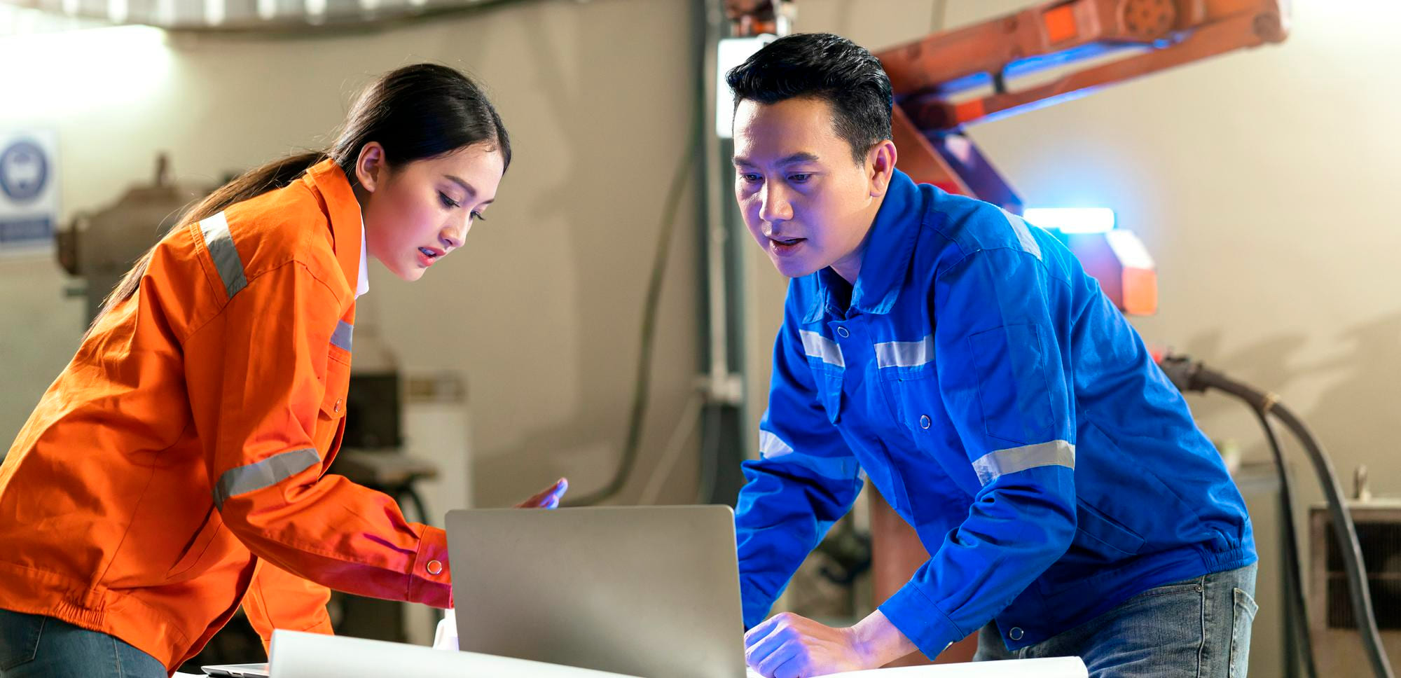 Workers discussing an operational plan at a project site