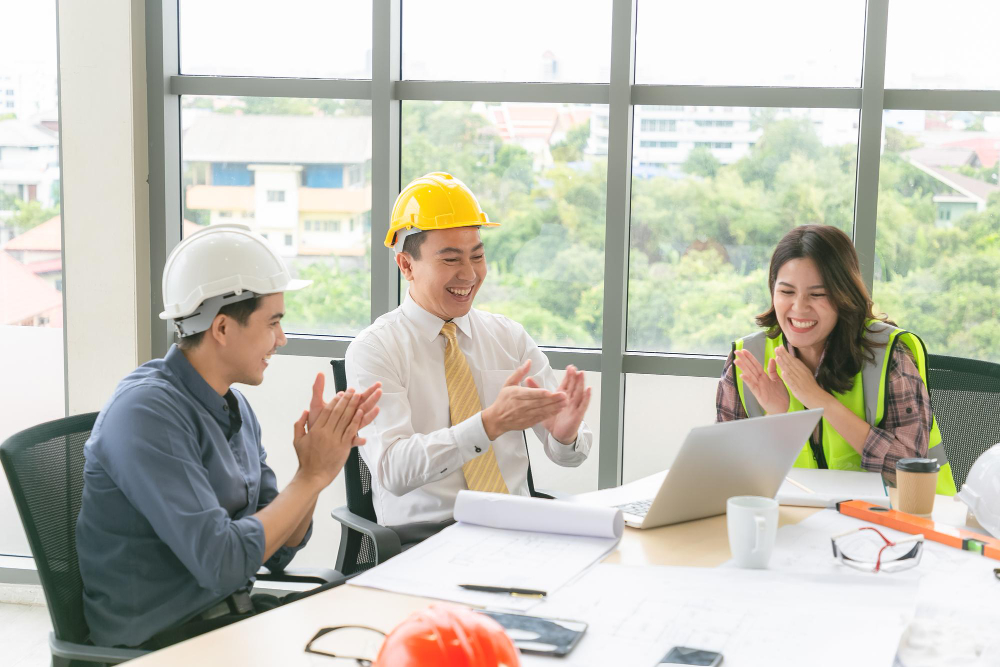 Recruiters and engineers collaborating in a meeting at a construction management recruitment agency in Vietnam.