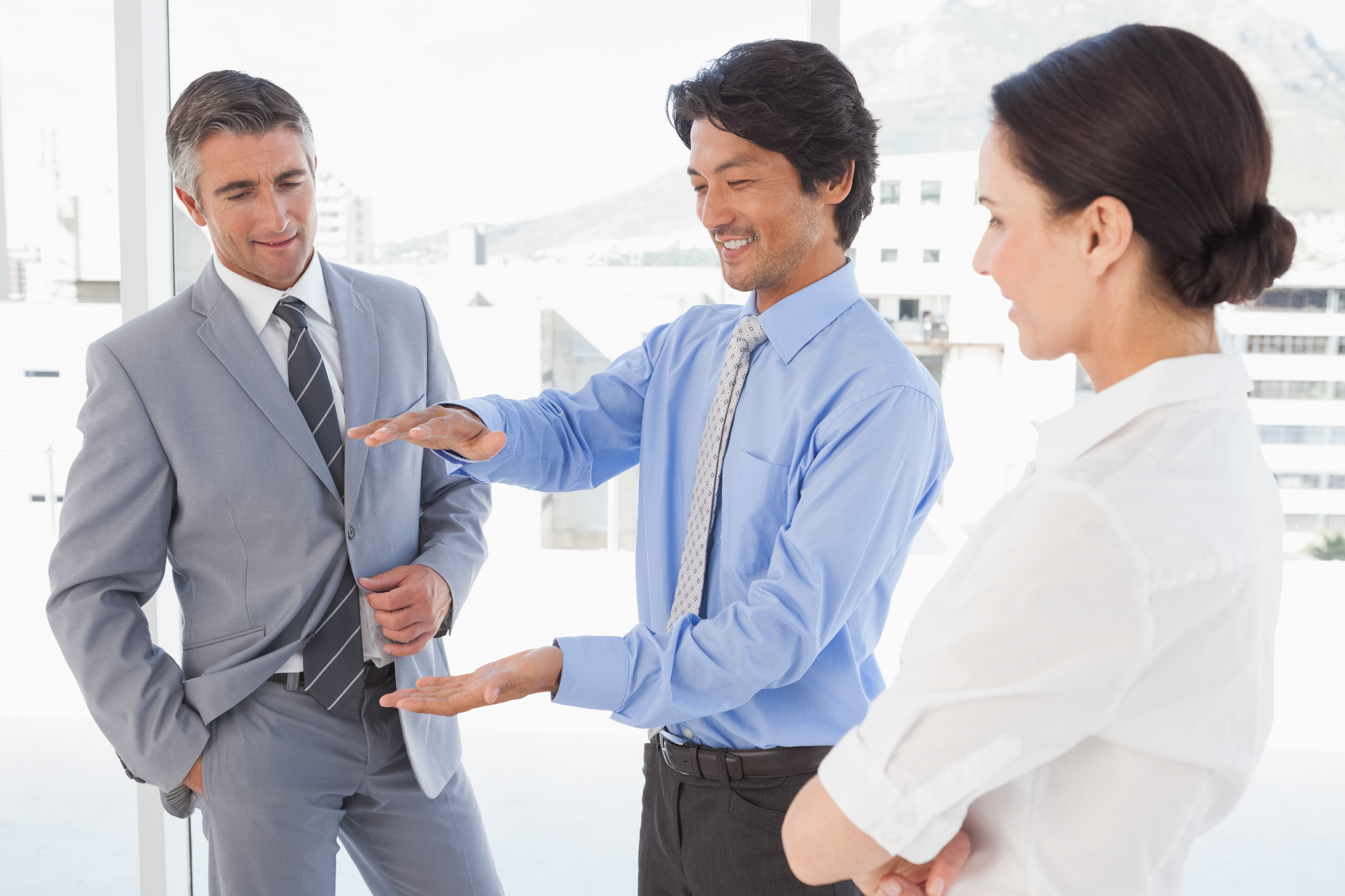 happy managers having discussion about degrees in hiring