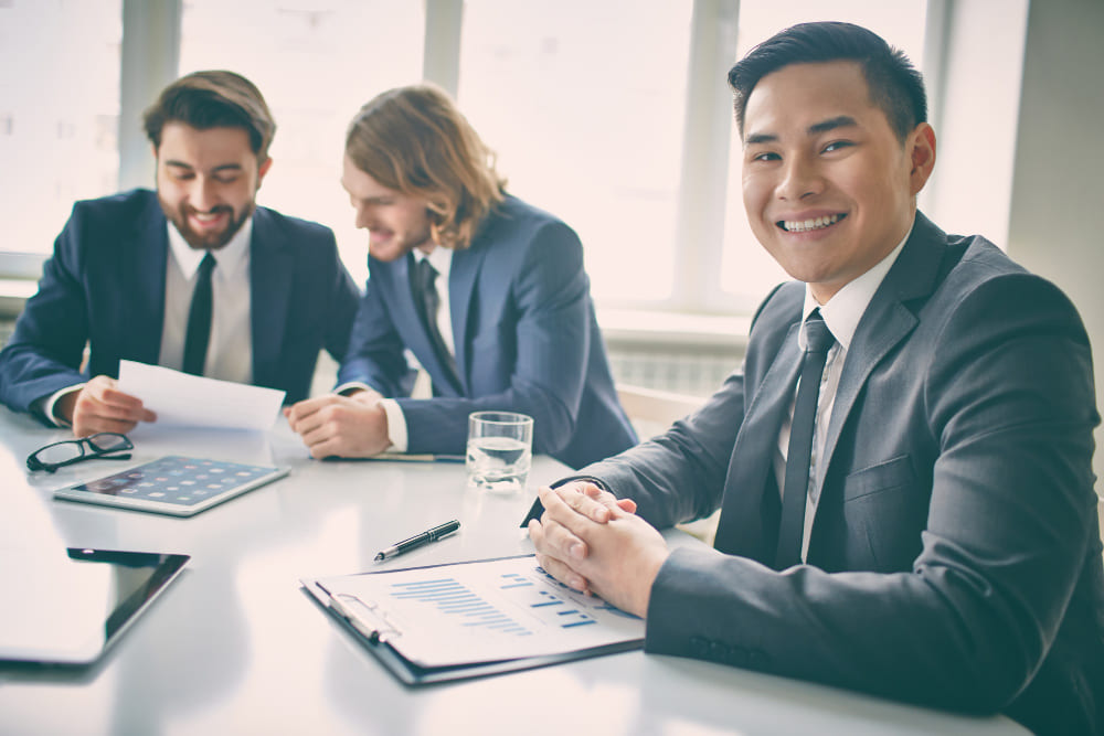 Consultants reviewing intellectual property protection and employer of record services contracts