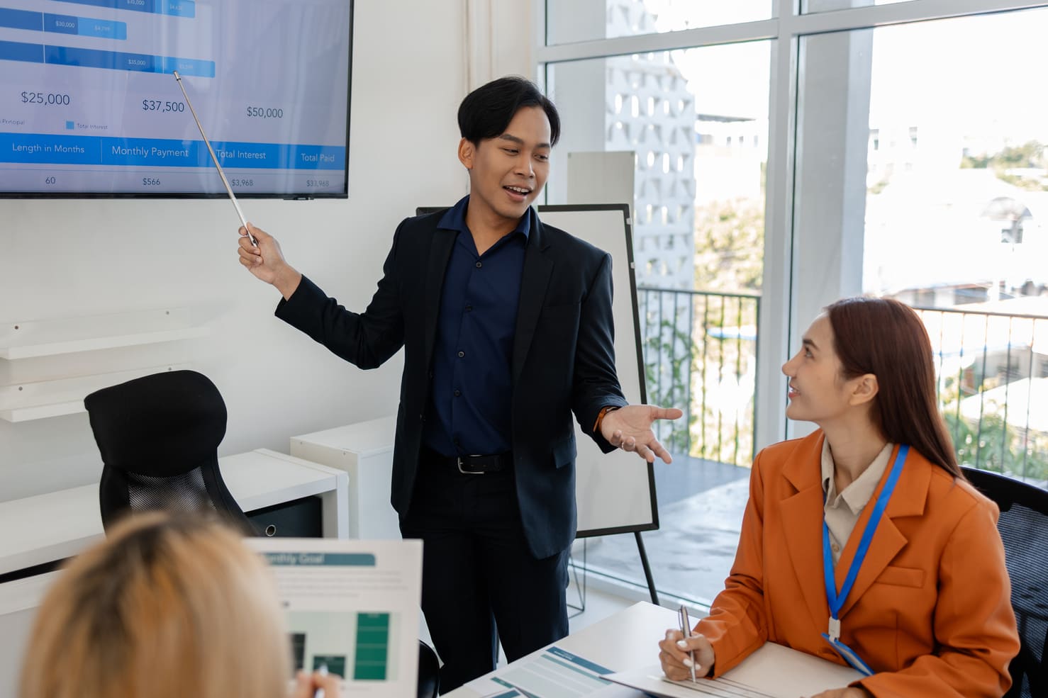 Staffing account manager presenting client satisfaction and operational quality metrics during a governance meeting