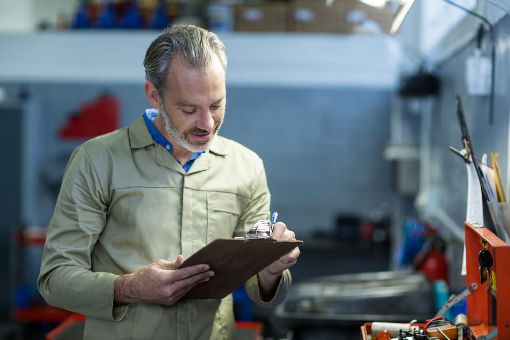 Plant manager reviewing production line handover criteria
