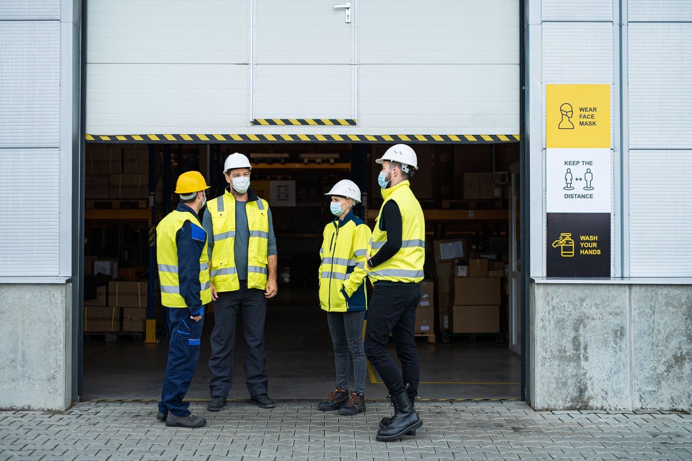 New factory operators arriving at the plant entrance on their first day of work