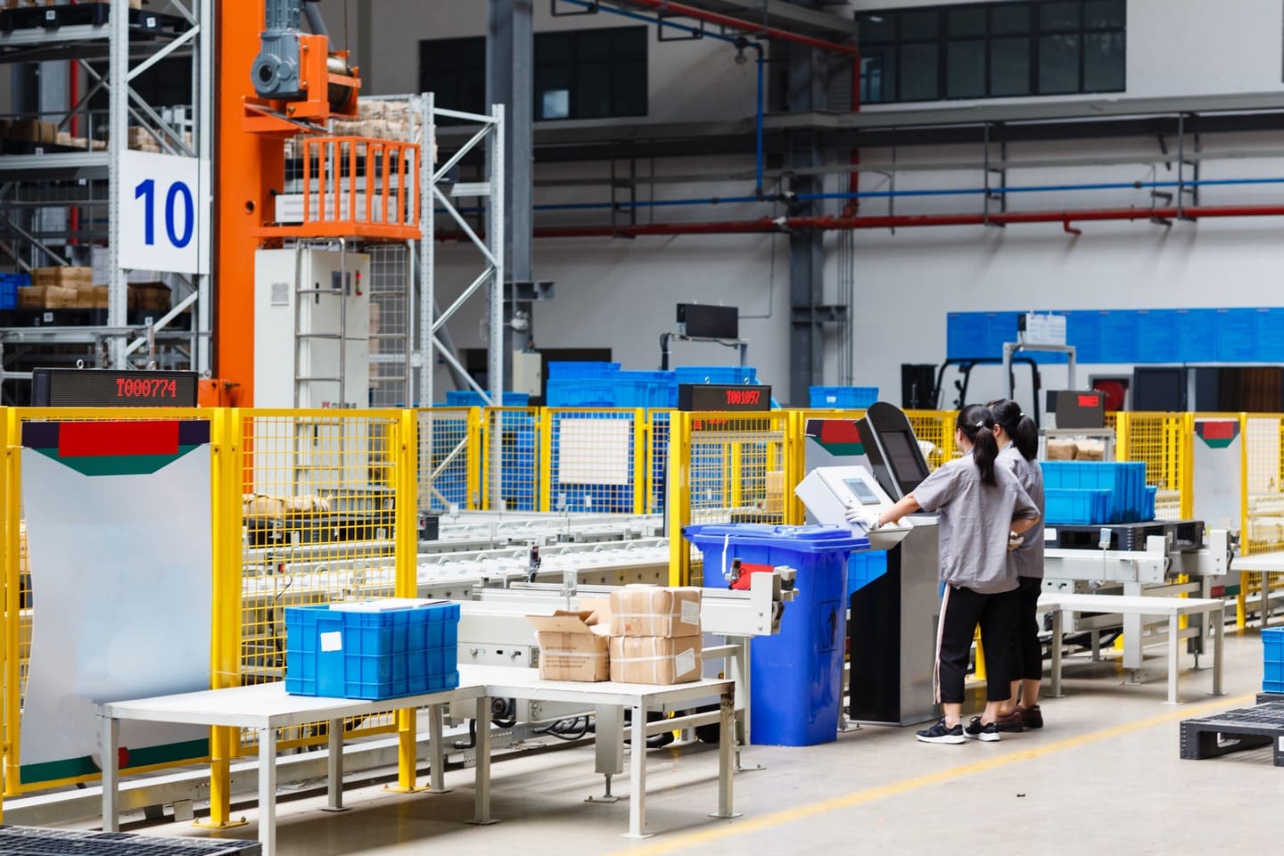 Industrial manufacturing facility floor with workers operating automated production lines in Vietnam