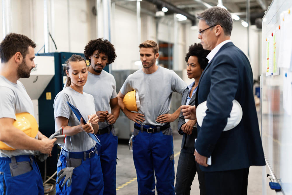 Newly hired temporary factory workers attending safety orientation and training