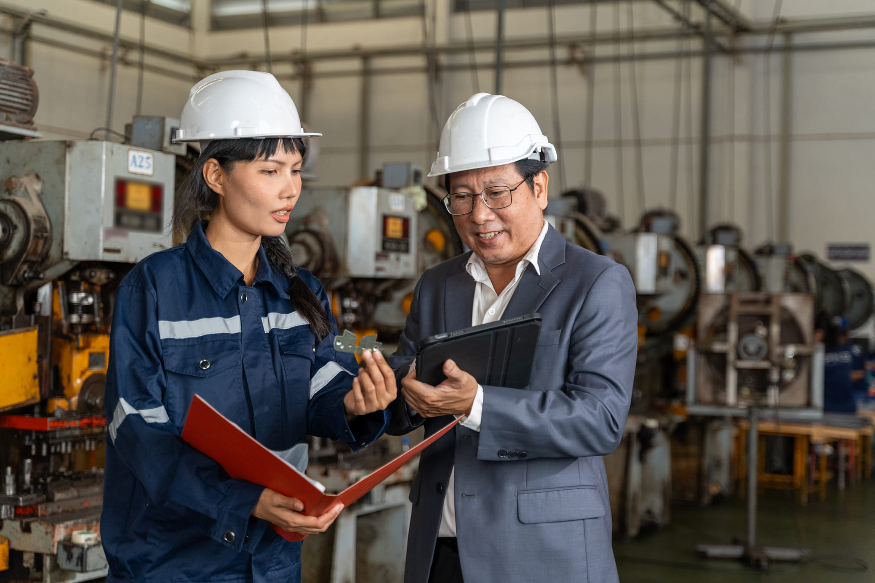 Plant manager and external staffing consultant reviewing operational shift assignments