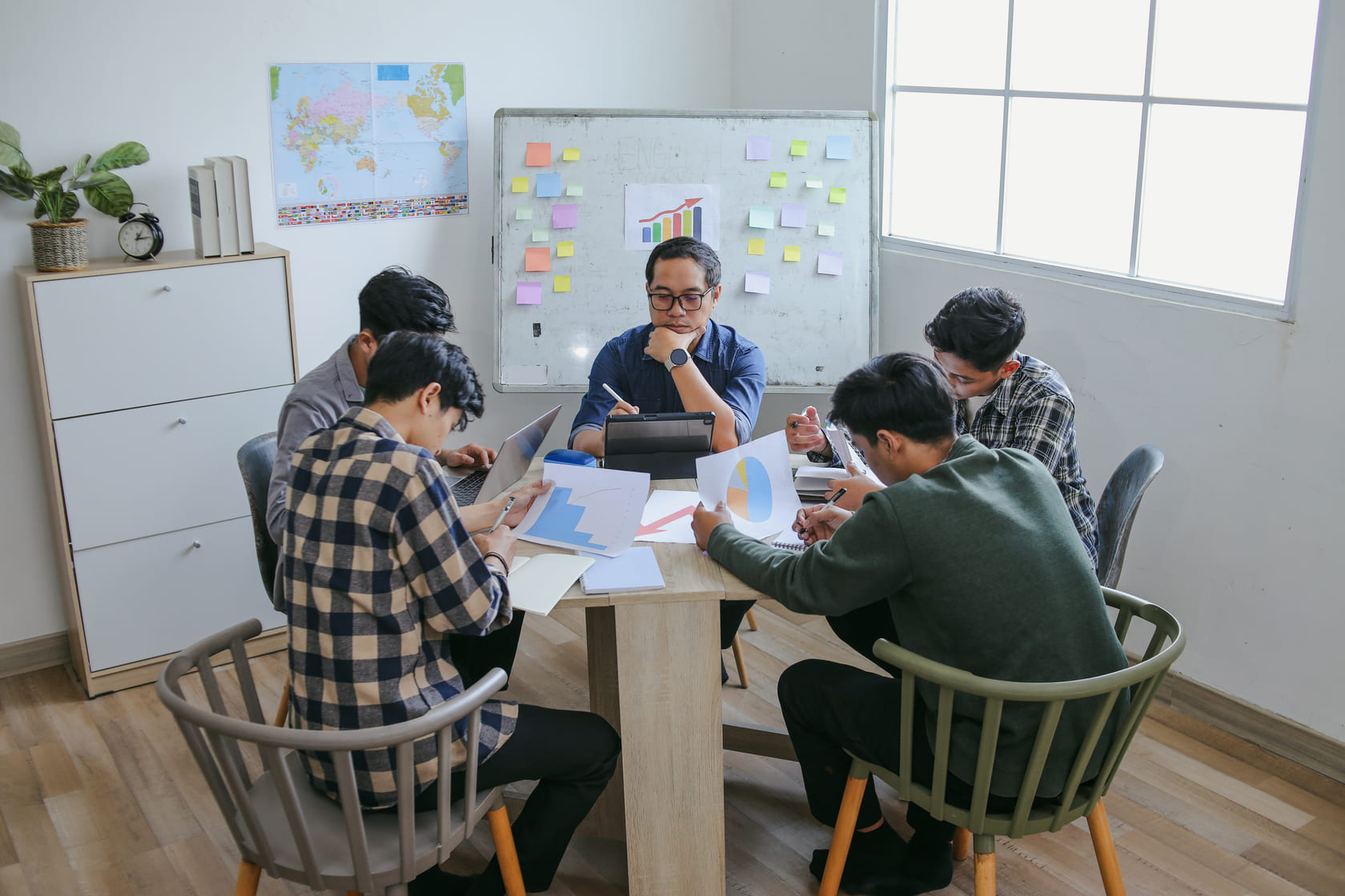 Corporate leadership meeting discussing sensitive employee relations matter