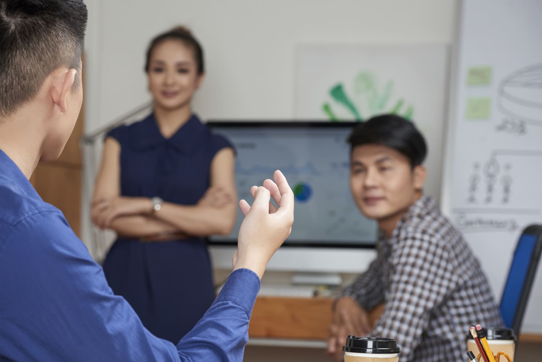 Staffing partner representative discussing operational capabilities with corporate clients in a meeting room