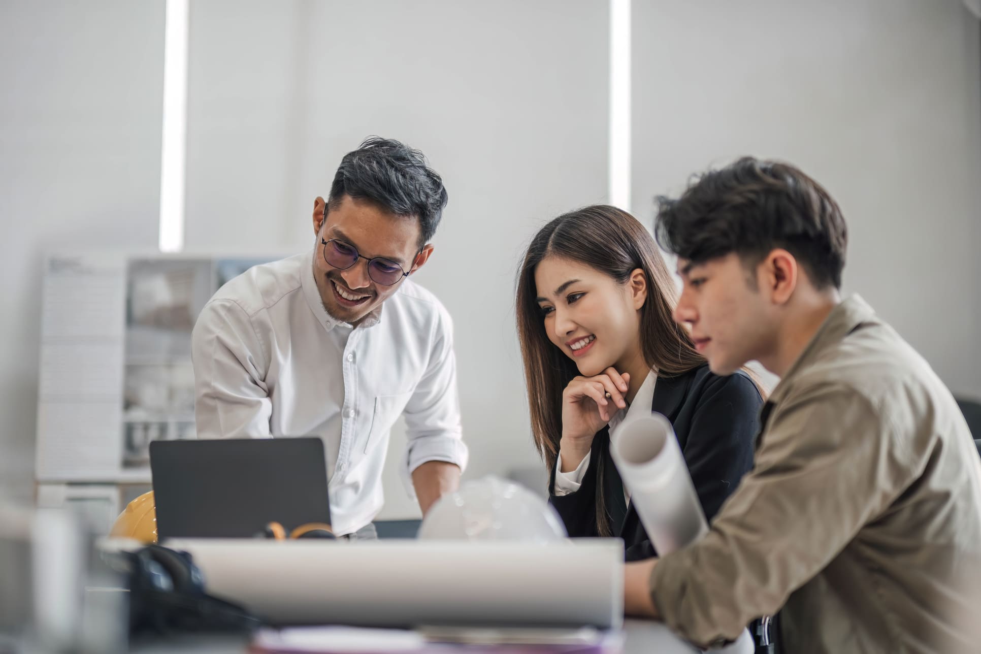 Specialized IT and engineering contract workers collaborating on a tech project.