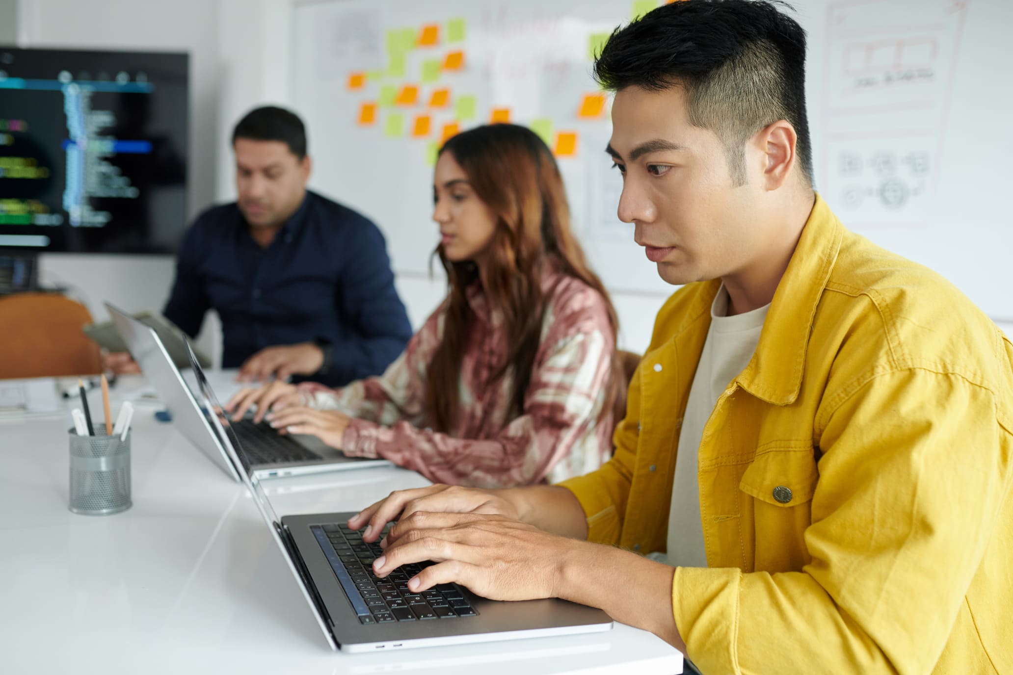 Software engineers and IT professionals working collaboratively on high-tech projects.